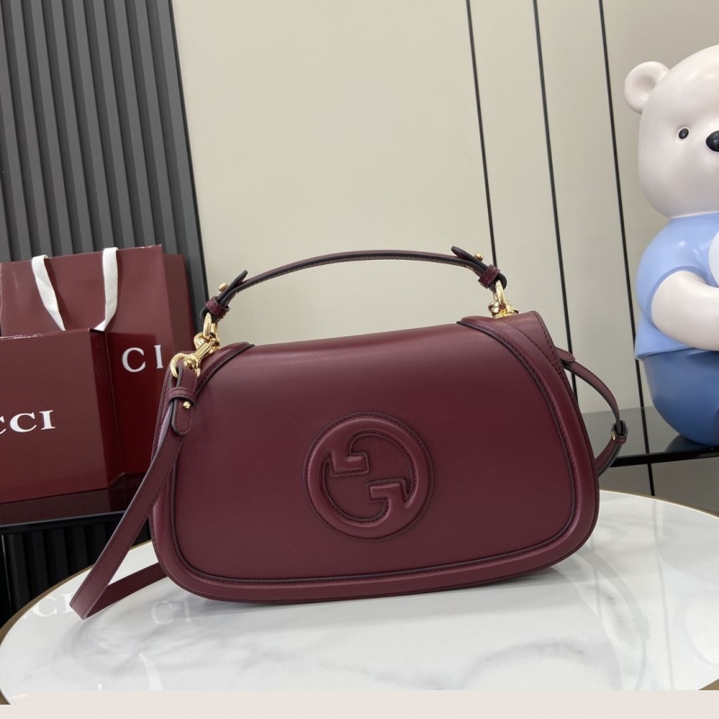 G*u*i top handle bags